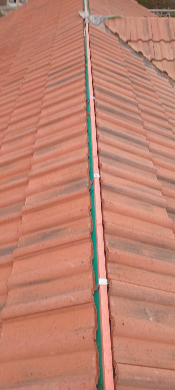 Roof and ridge line with guttering along the eaves